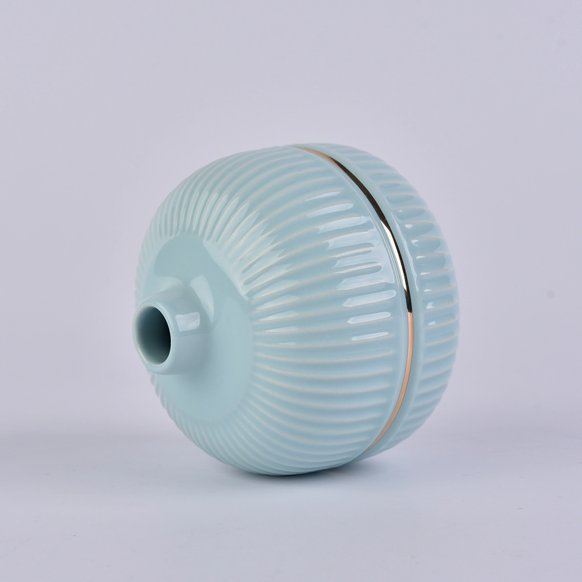 blue round ceramic bottle with gold rim, ceramic oil bottles