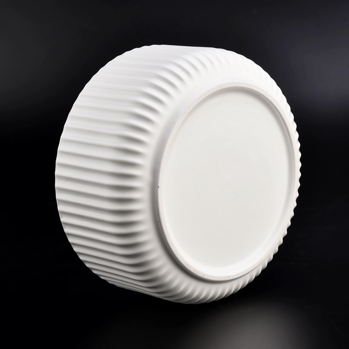 matte white glazed ceramic candle jars with stripe designs