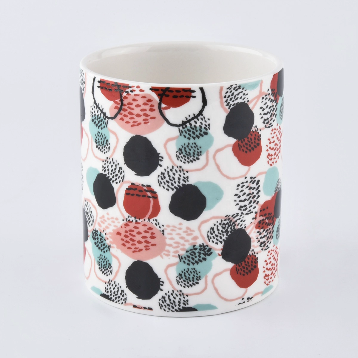 colorful ceramic candle jars with printing all around the jars