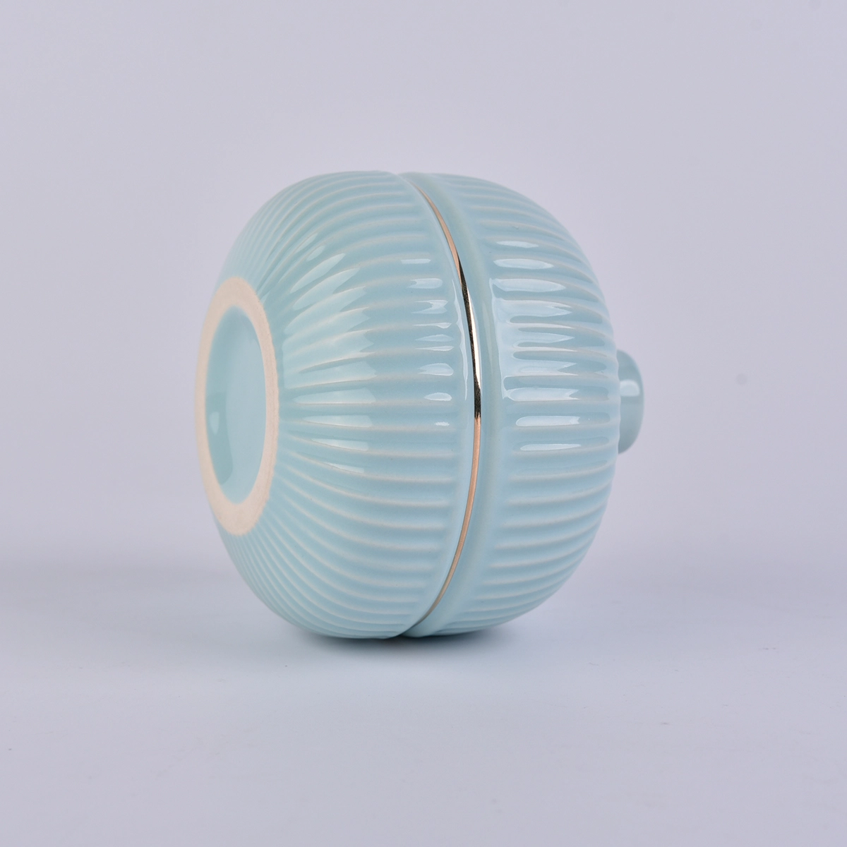 blue round ceramic bottle with gold rim, ceramic oil bottles