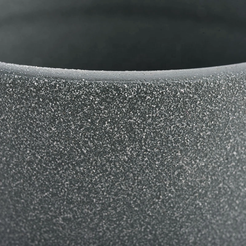 ceramic candle vessels with rough stone finish