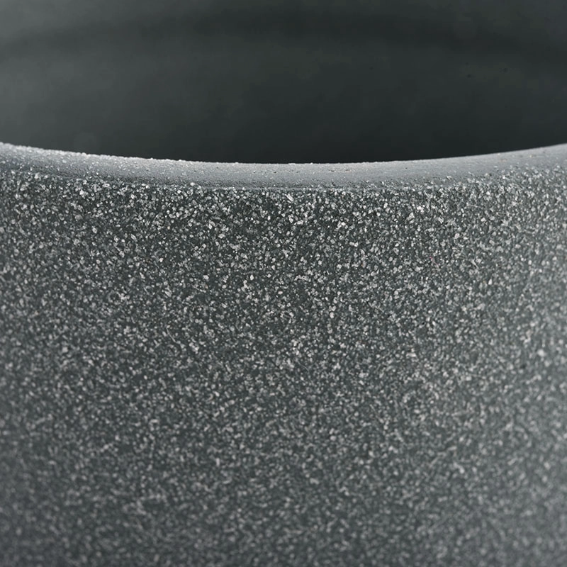 ceramic candle vessels with rough stone finish