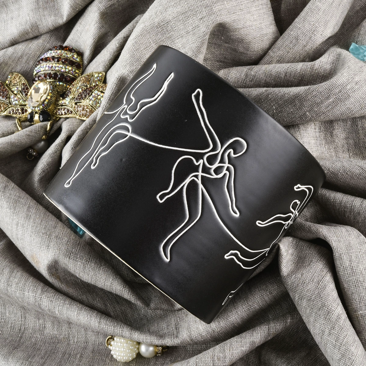 black ceramic candle jars with white printing