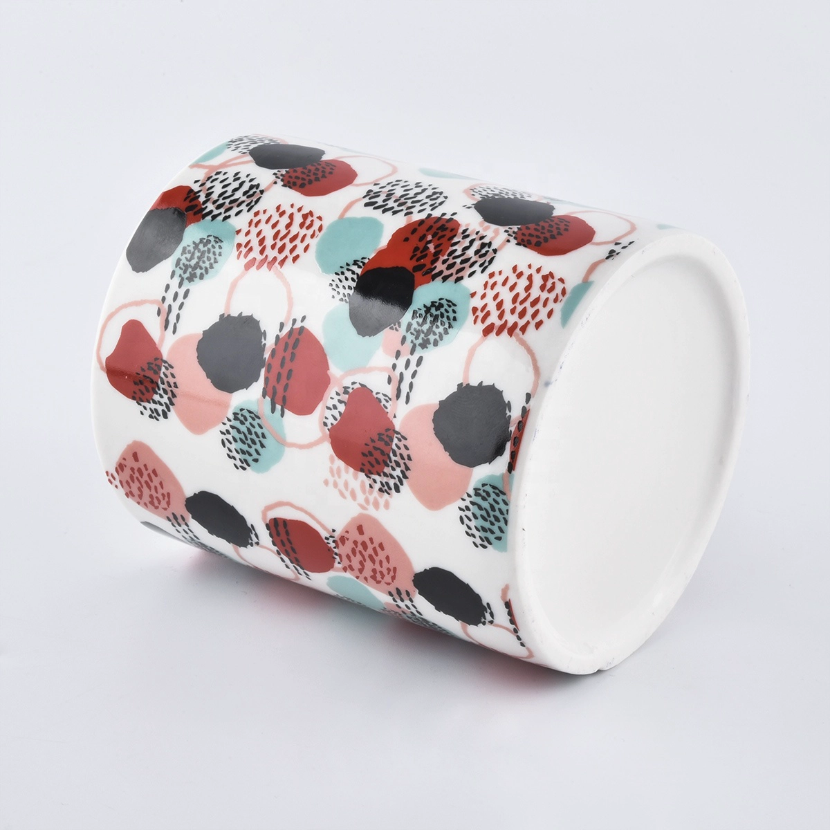 colorful ceramic candle jars with printing all around the jars