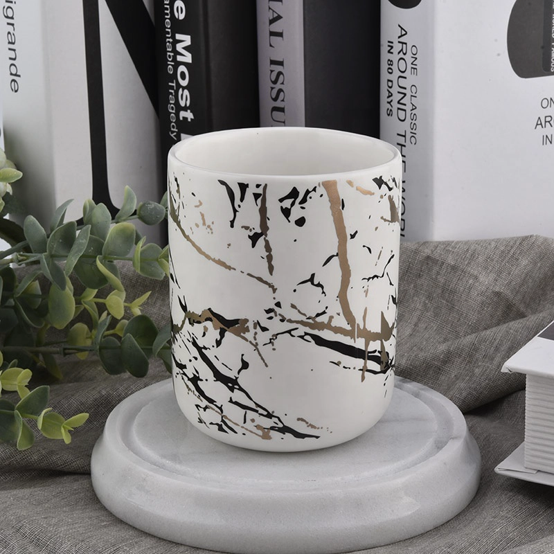 matt white ceramic candle jars with artwork