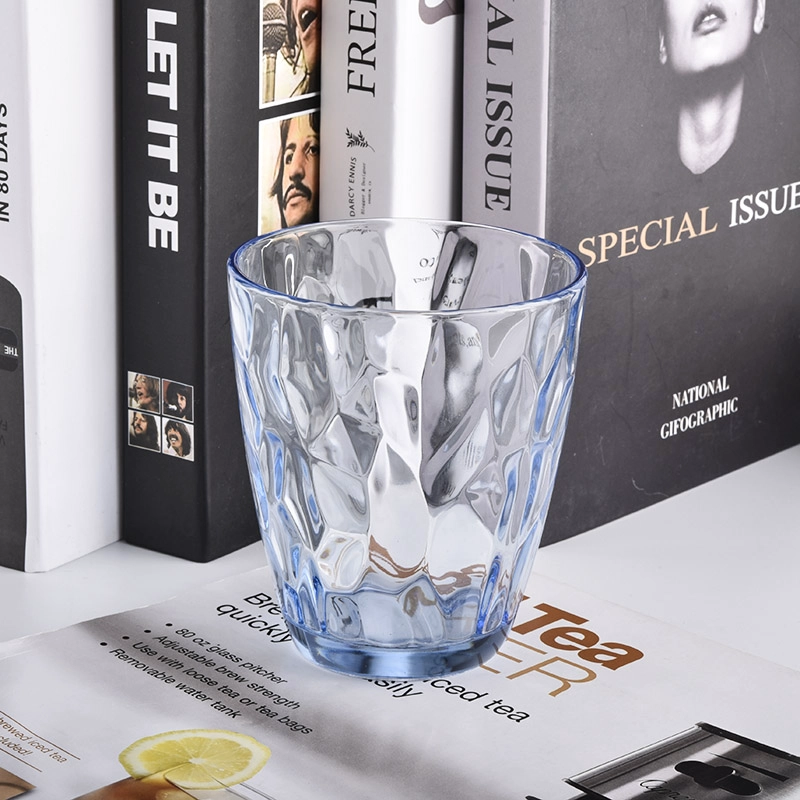 transparent blue glass candle holders with knock patterns