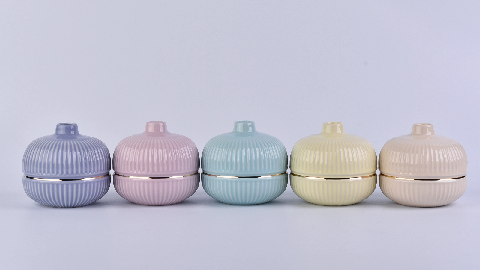 blue round ceramic bottle with gold rim, ceramic oil bottles