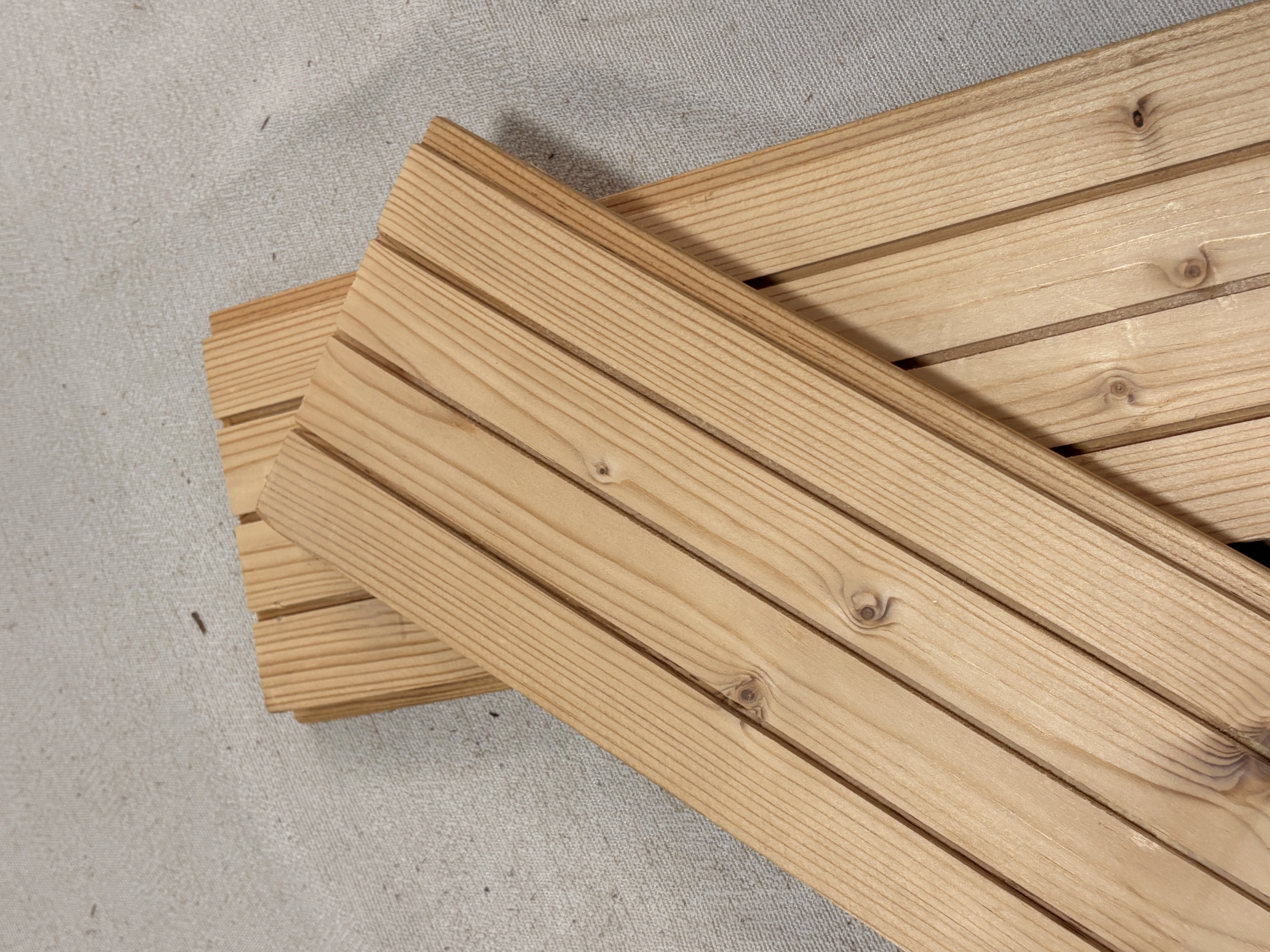 Carbonized Thermally Modified Spruce Strips for Sauna Rooms