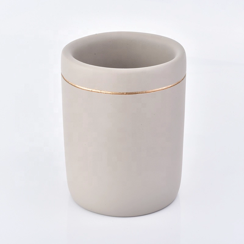 grey concrete bath room accessories with lotion bottles dispenser toothbrush holder