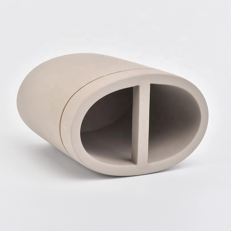 grey concrete bath room accessories with lotion bottles dispenser toothbrush holder