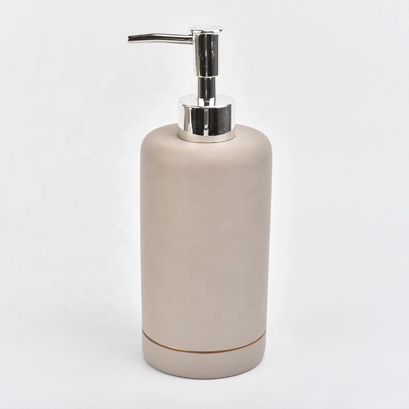 grey concrete bath room accessories with lotion bottles dispenser toothbrush holder