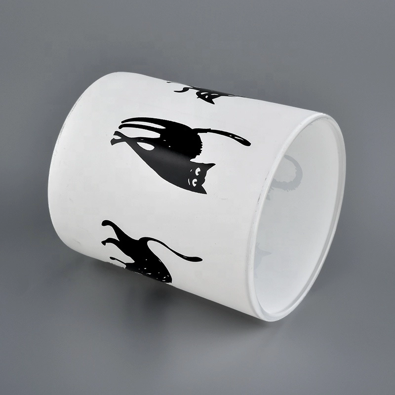 White glass candle jars with black printing