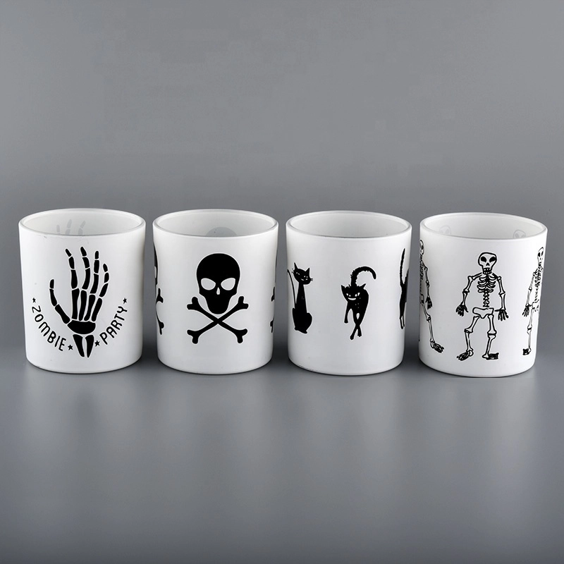 White glass candle jars with black printing