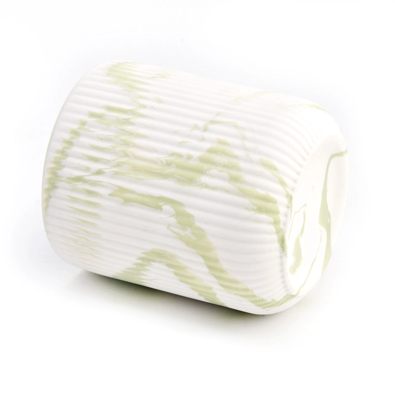 green and white decorative candle jar fluted ceramic vessel