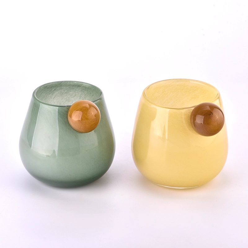 Mouth blown glass candle jars with round handle 