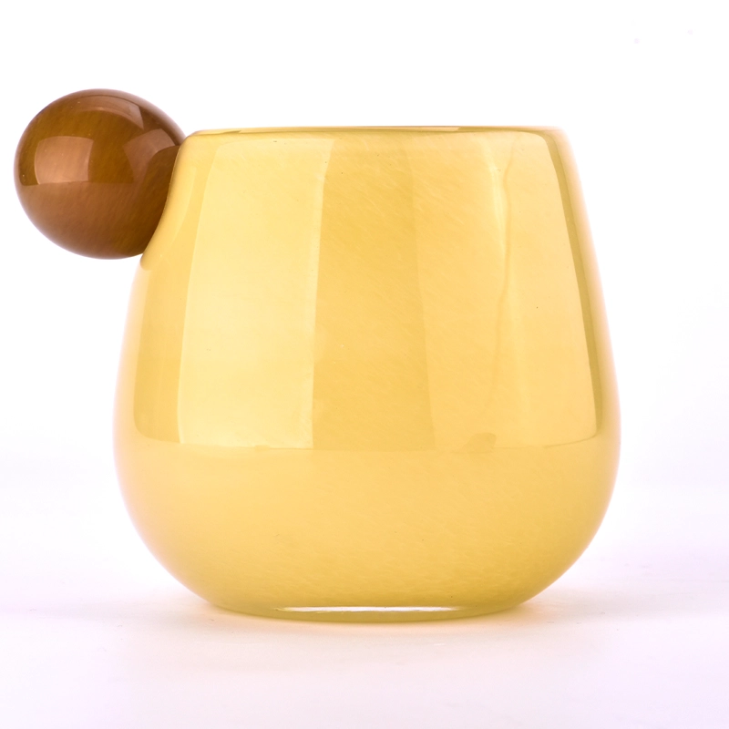 Mouth blown glass candle jars with round handle 