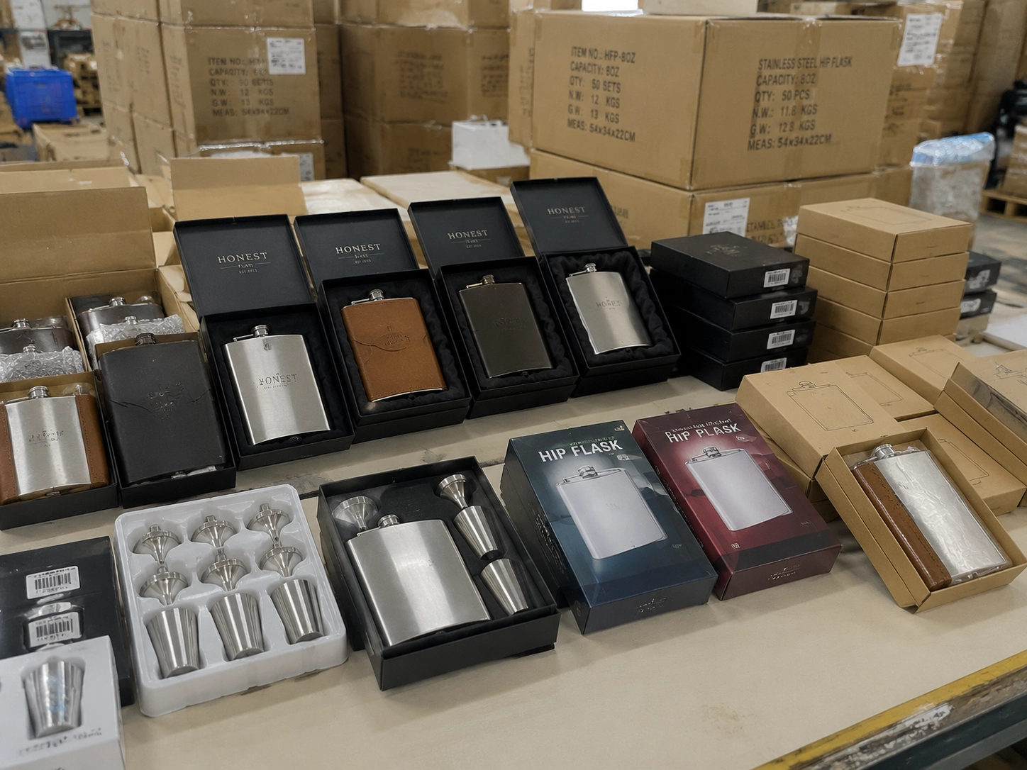 Bulk packaging and warehouse display of stainless steel hip flasks with gift boxes and retail packaging for wholesale supply