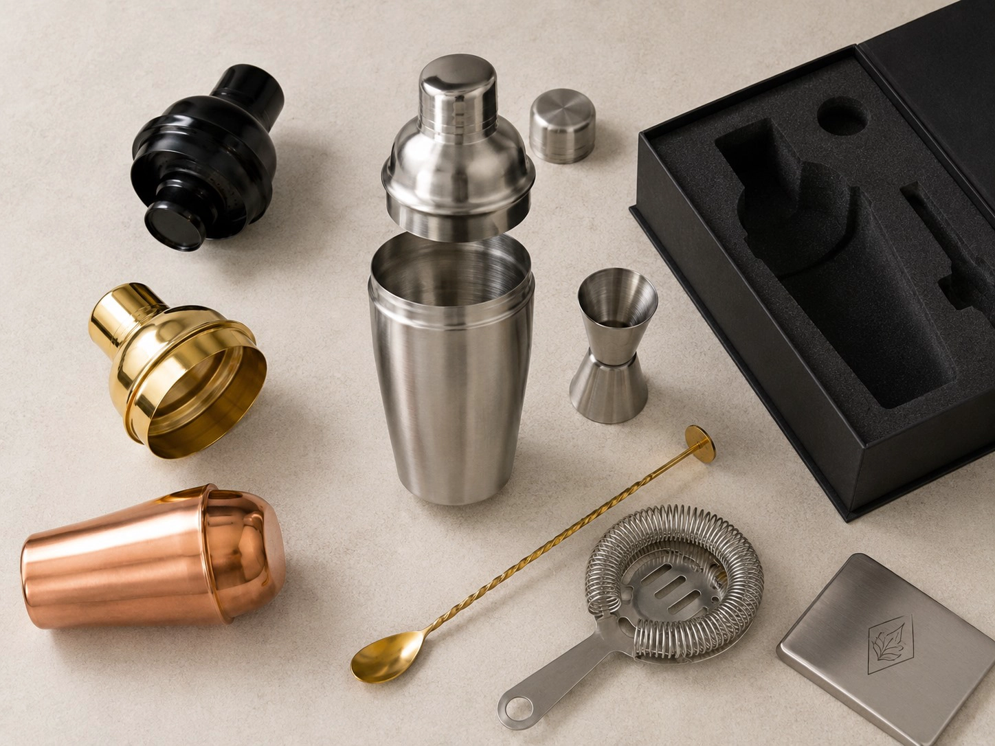 Custom cocktail shaker hybrid development set with interchangeable shaker parts, jigger, strainer, bar spoon and custom packaging