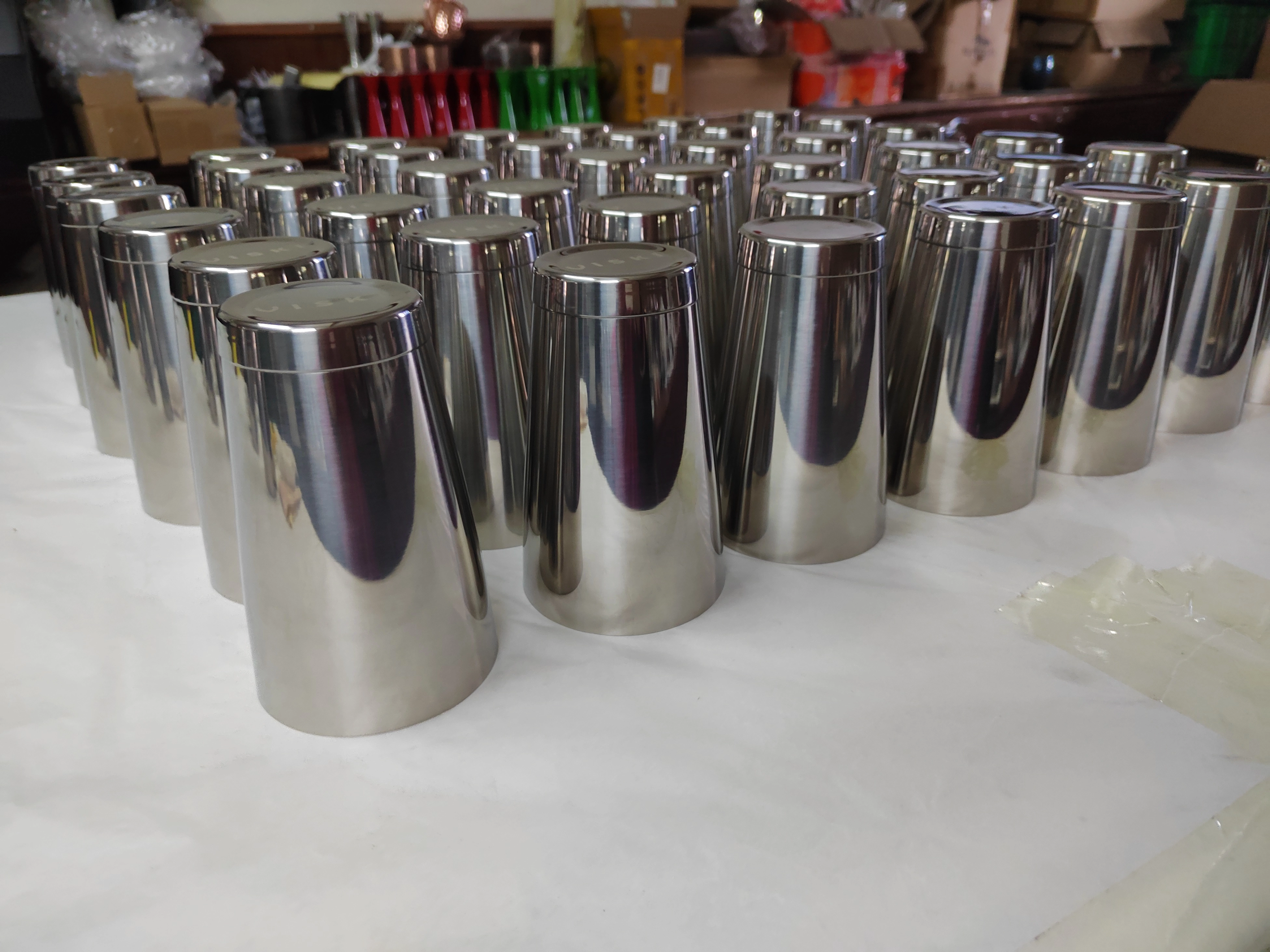 Bulk stainless steel cocktail shaker bodies arranged for production quality inspection at the factory