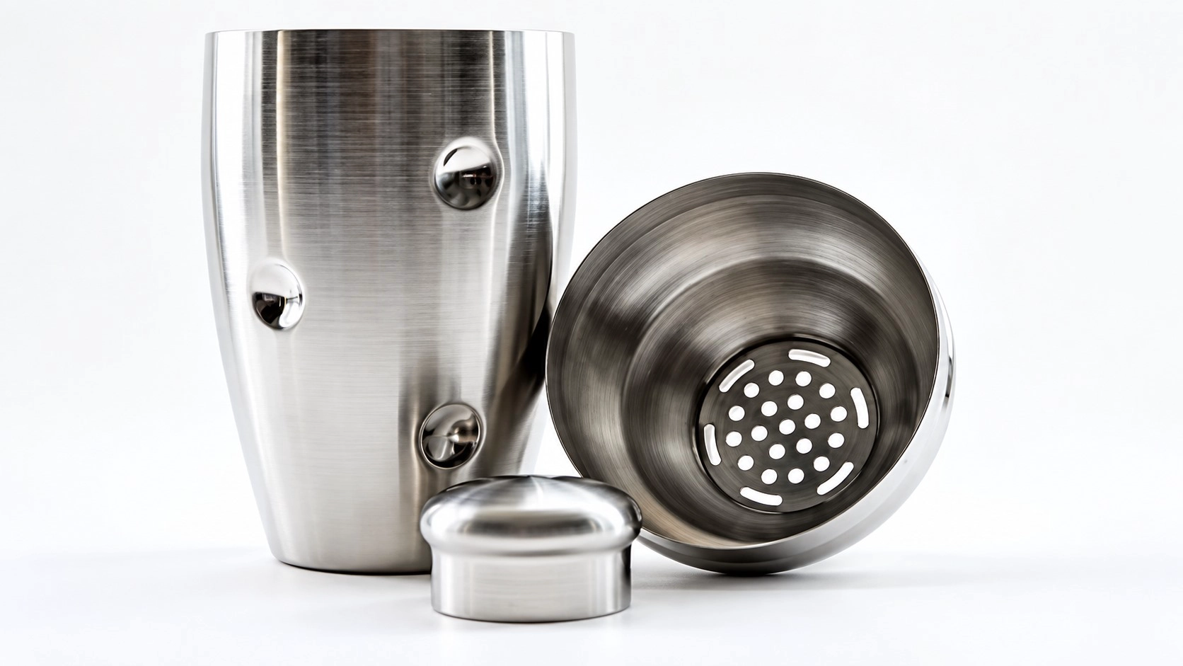 Stainless steel cobbler cocktail shaker with built-in strainer and removable cap.
