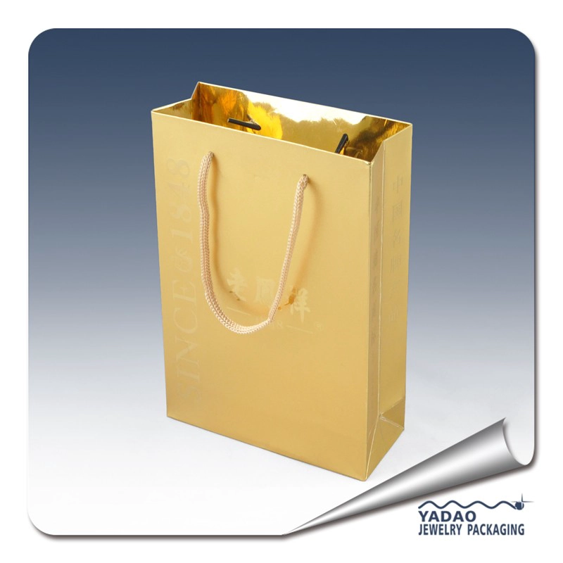 China Gold color paper jewelry gift bags with handle and gold color logo Chian supplier manufacturer