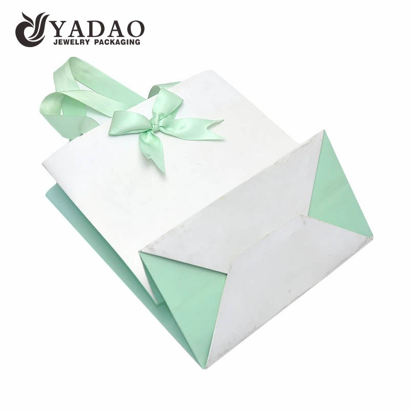 China Yadao printing paper bag jewelry packaging bag shopping bag gift bag in three colors printing with ribbon handle and closure manufacturer