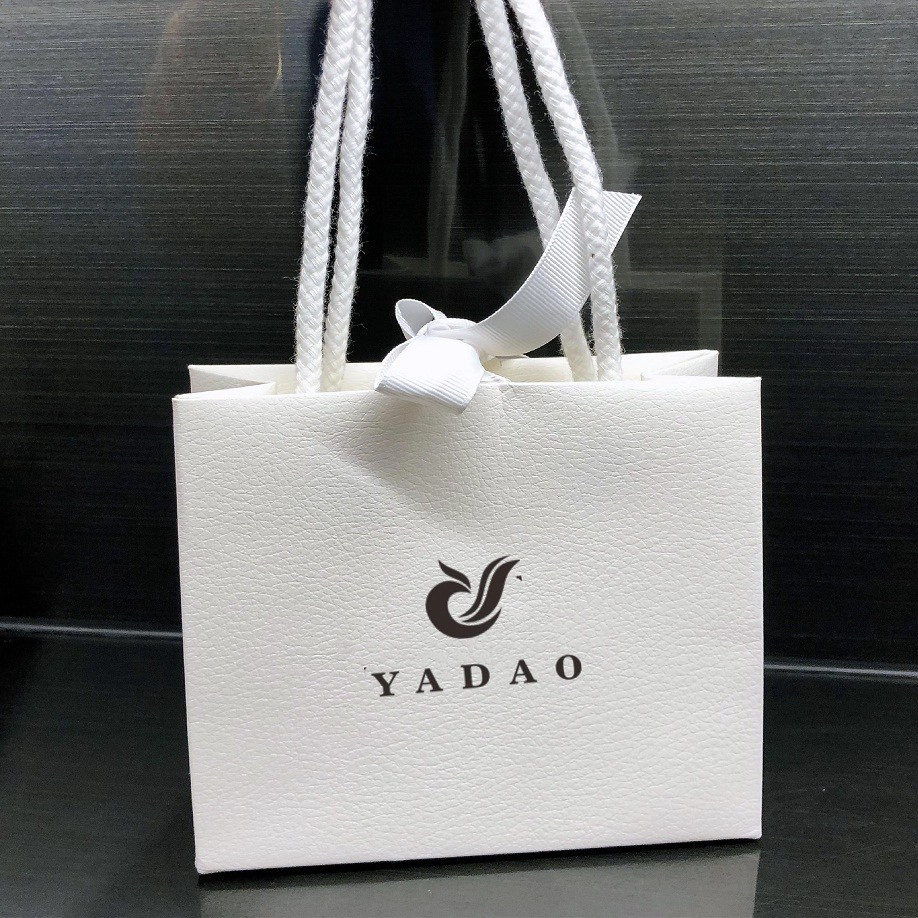 China Yadao wholesales shopping paper bag with cotton rope and ribbon closure white color gift packaging bag manufacturer