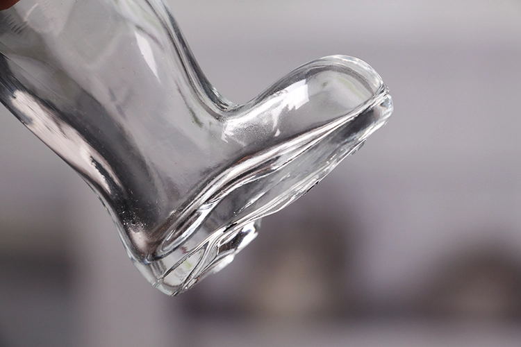 Boot shaped glass bottle
