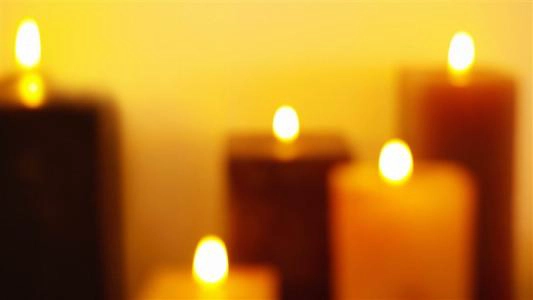 What happens if a lit candle is lowered in a container filled with liquid oxigen?