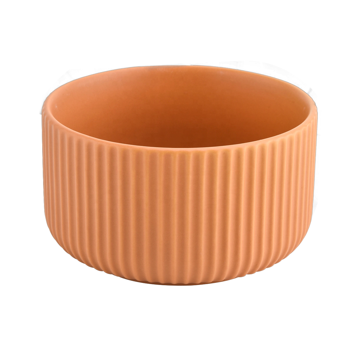 peach glazed ceramic candle vessels with stripe designs