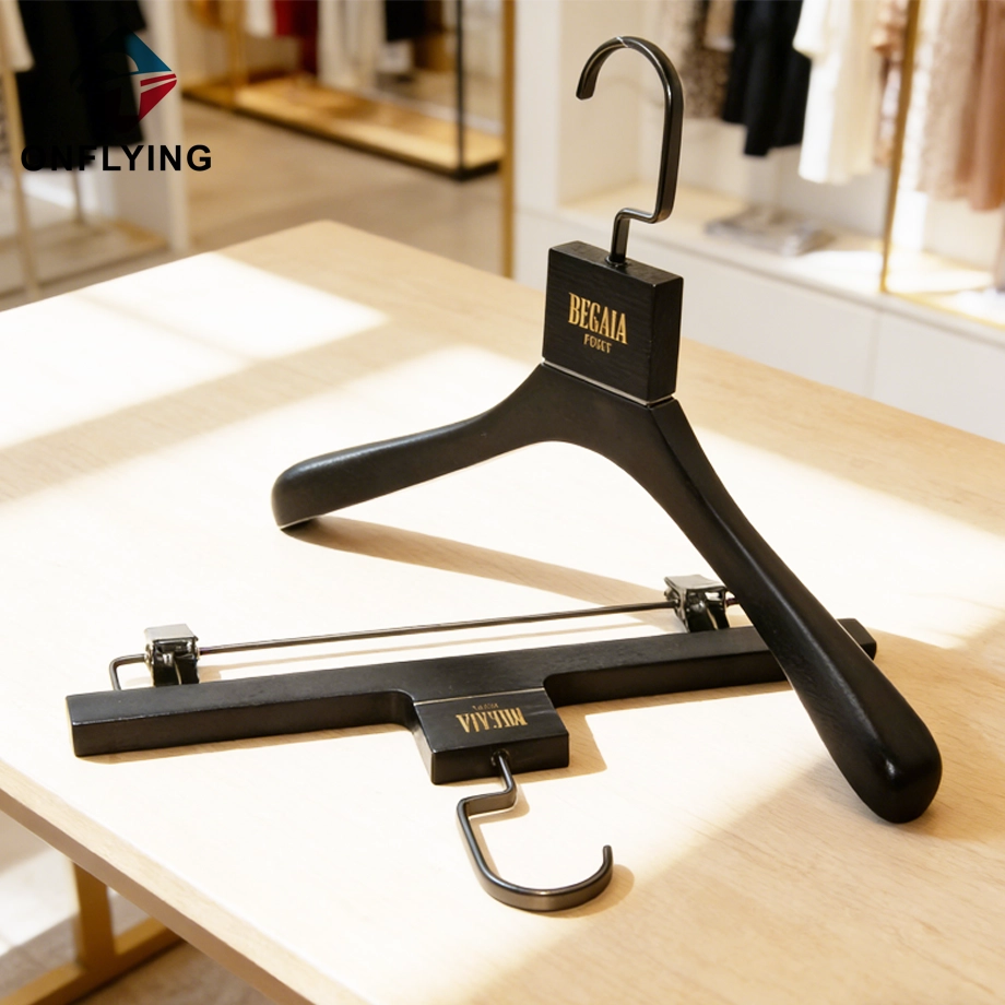 Elegantes Kleiderbügel-Set aus schwarzem Eschenholz für Damenbekleidung, China-Fabrik