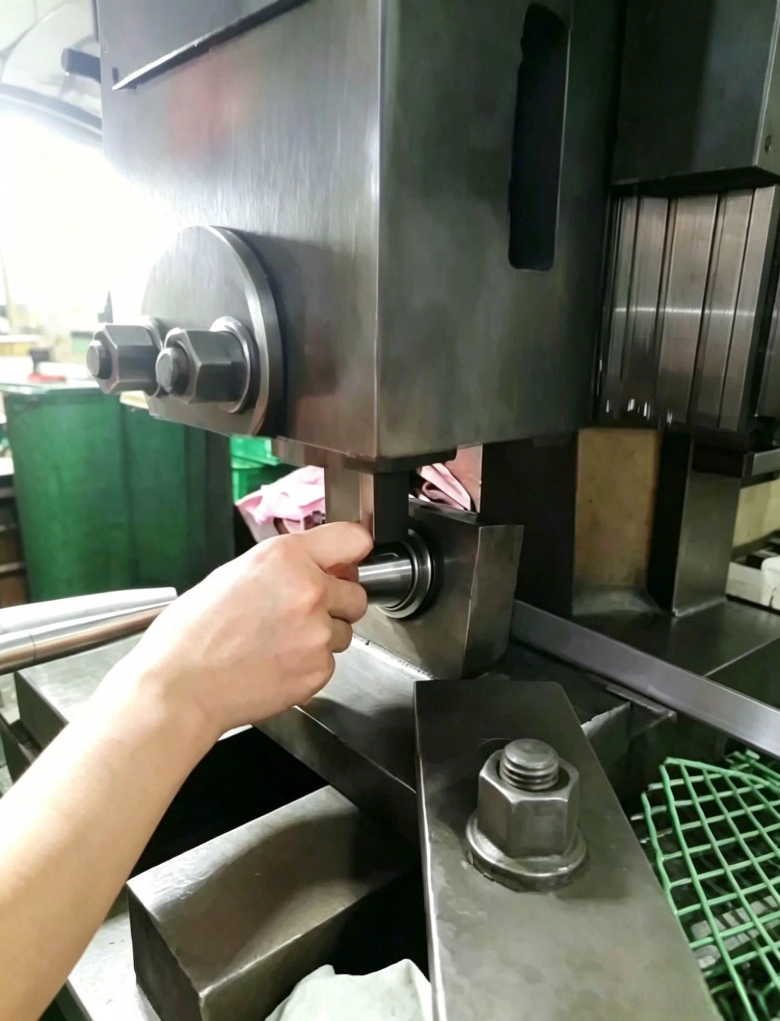 Precision mechanical stamping of graduation lines on a stainless steel cocktail jigger using custom calibrated support mandrels.