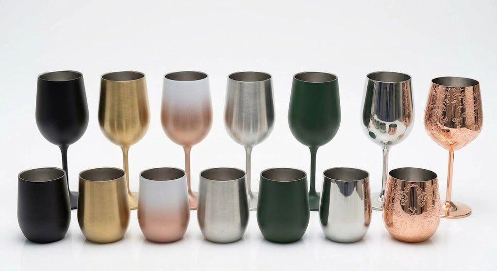 Collection of stemmed and stemless stainless steel wine glasses in multiple colors including matte black, gold, gradient rose gold, brushed silver, and green for wholesale。